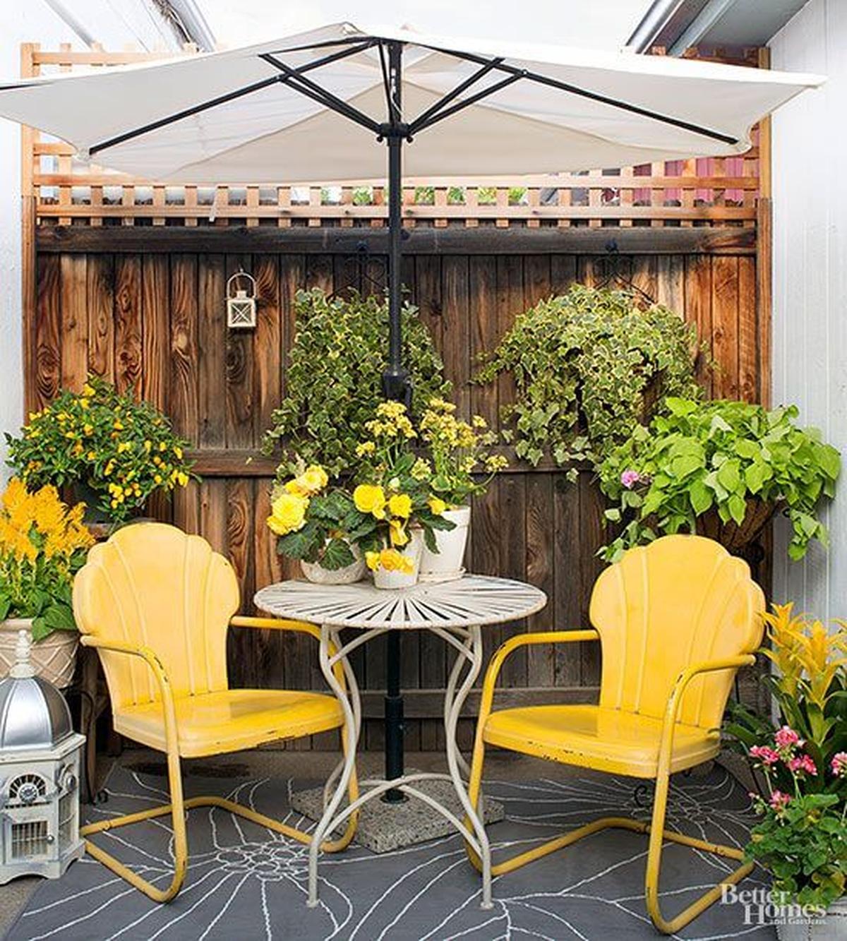 Yellow Iron Chairs With The Same Color Flowers With Basket Indoor Plants