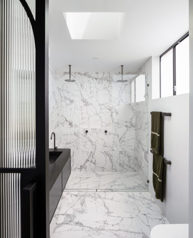 Sleek Marble Bathroom with Dual Shower Features